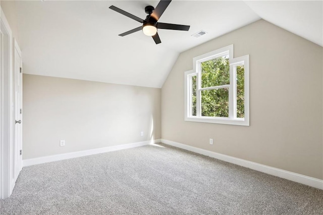 additional living space featuring carpet, vaulted ceiling, and ceiling fan