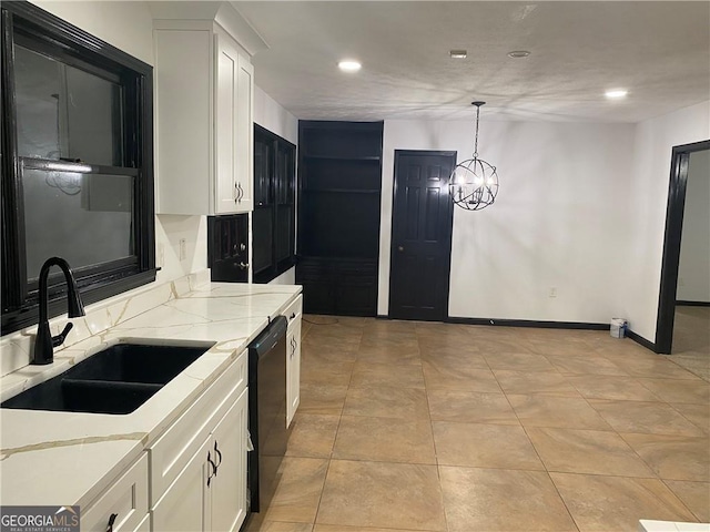 kitchen featuring a sink, light stone counters, black dishwasher, and white cabinets