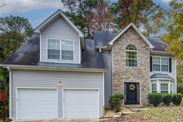 view of front of property with a garage