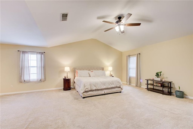 bedroom with carpet flooring, ceiling fan, and vaulted ceiling