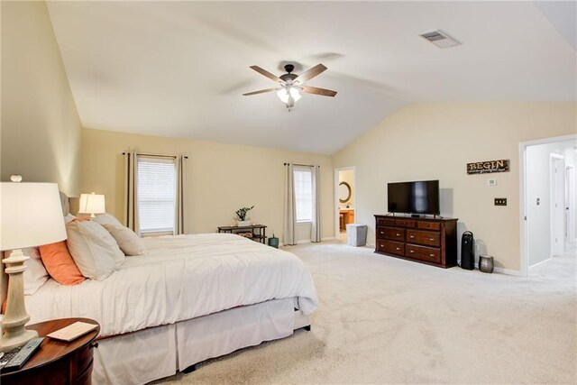 carpeted bedroom with ceiling fan, lofted ceiling, and multiple windows