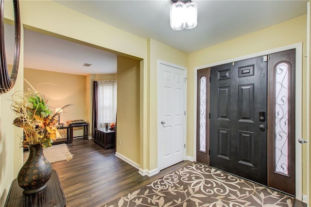 entrance foyer featuring dark hardwood / wood-style floors