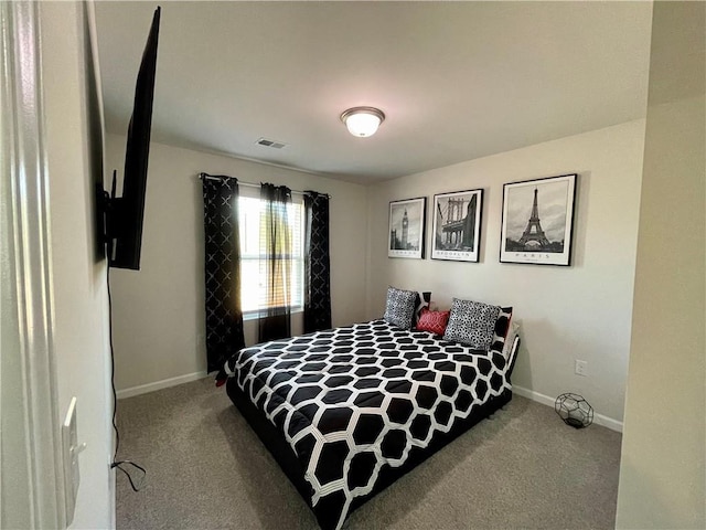 bedroom with light colored carpet