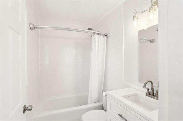 full bathroom featuring vanity, shower / bath combo with shower curtain, and toilet