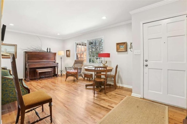 sitting room featuring hardwood / wood-style flooring and ornamental molding