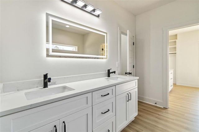 bathroom with vanity and hardwood / wood-style flooring