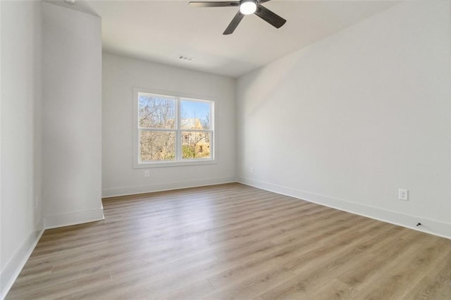 spare room with ceiling fan and light hardwood / wood-style flooring