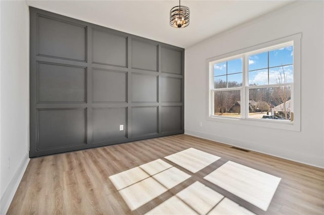 unfurnished bedroom featuring light wood-type flooring