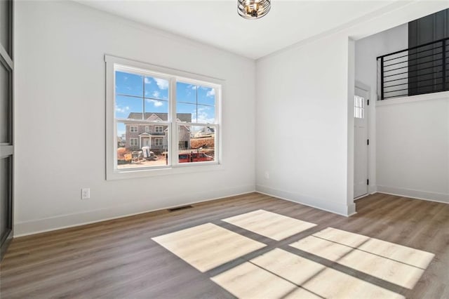 empty room featuring hardwood / wood-style floors