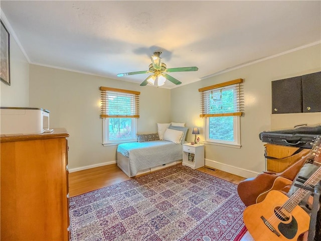 5130 Dearing St, Covington, GA 30014 - bedroom with wood finished floors, crown molding, and ceiling fan