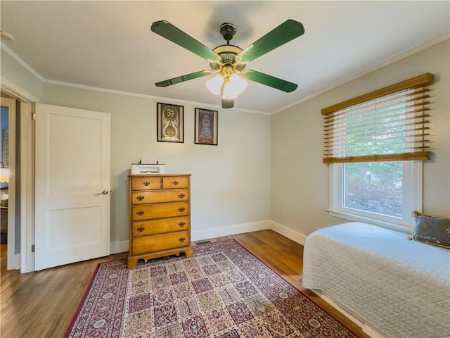 5130 Dearing St, Covington, GA 30014 - bedroom with wood finished floors, ornamental molding, and a ceiling fan