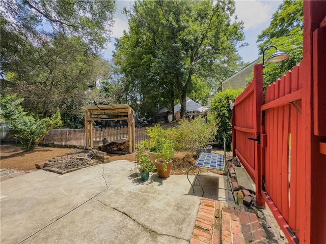 5130 Dearing St, Covington, GA 30014 - fenced backyard with a patio area