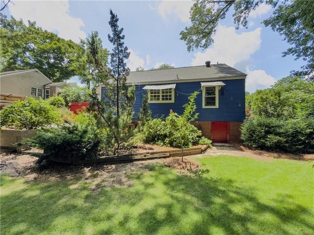 5130 Dearing St, Covington, GA 30014 - rear view of property featuring a lawn