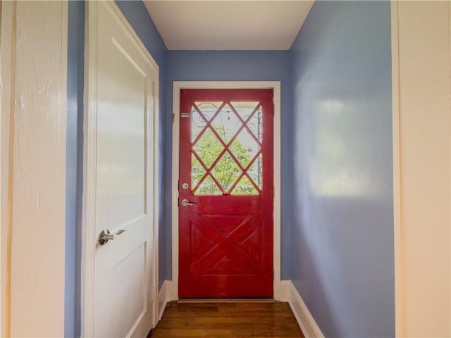 5130 Dearing St, Covington, GA 30014 - doorway featuring baseboards and dark wood finished floors