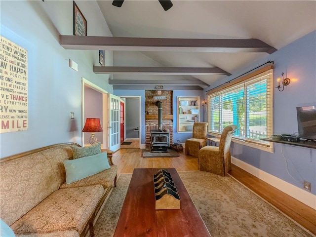 5130 Dearing St, Covington, GA 30014 - living area with a wood stove, wood finished floors, and french doors