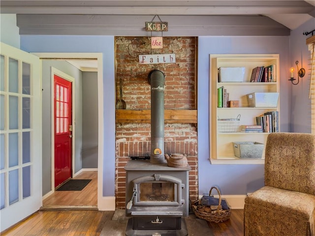 5130 Dearing St, Covington, GA 30014 - sitting room featuring a wood stove and wood finished floors
