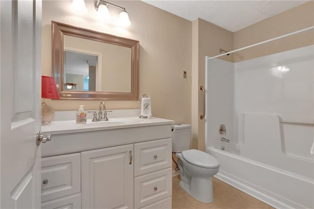 full bathroom featuring tile patterned flooring, vanity, a textured ceiling, bathtub / shower combination, and toilet