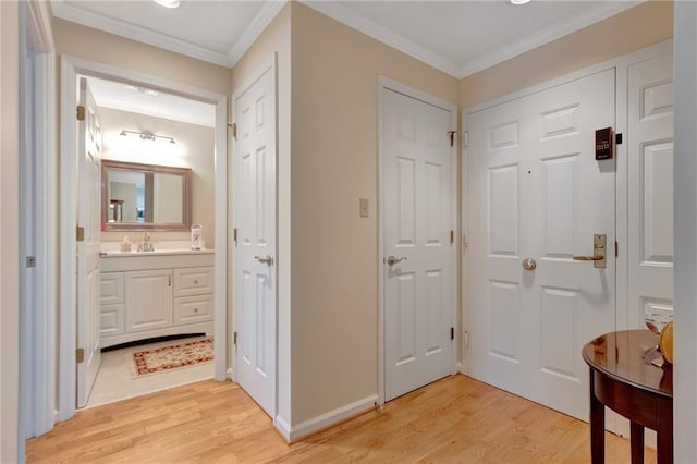 interior space with ornamental molding and light hardwood / wood-style floors