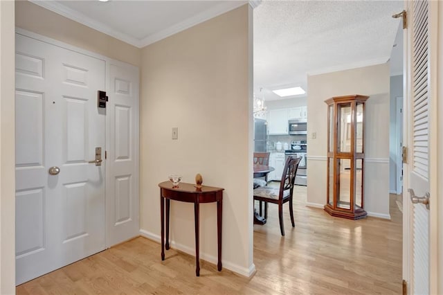 foyer with ornamental molding and light wood-type flooring