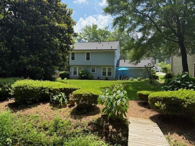 3545 Manchester Dr, Lawrenceville, GA 30044 - back of property featuring a lawn