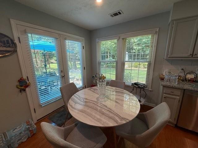 3545 Manchester Dr, Lawrenceville, GA 30044 - dining area with light wood-type flooring and plenty of natural light