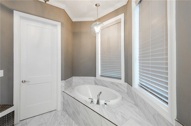 bathroom featuring a garden tub, marble finish floor, and crown molding