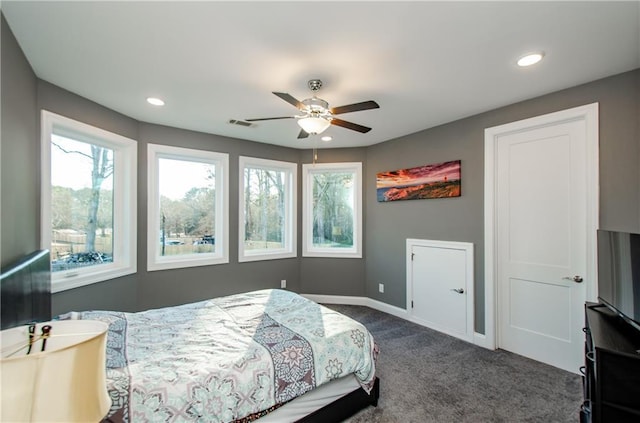 bedroom with dark colored carpet, recessed lighting, visible vents, and baseboards