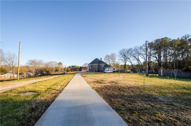 exterior space featuring a yard and fence