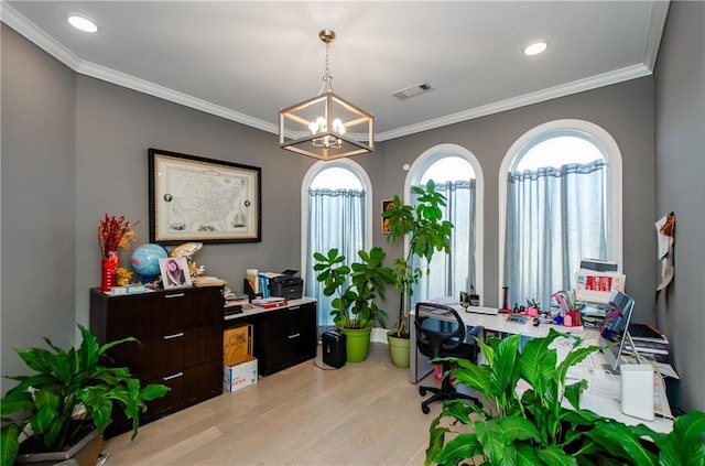 office area with a wealth of natural light, light hardwood / wood-style flooring, and ornamental molding