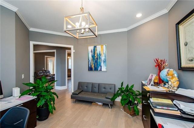 home office featuring ornamental molding, a chandelier, and light wood-type flooring