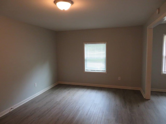 empty room featuring dark hardwood / wood-style floors