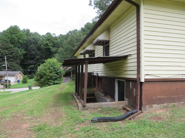 view of property exterior with a lawn