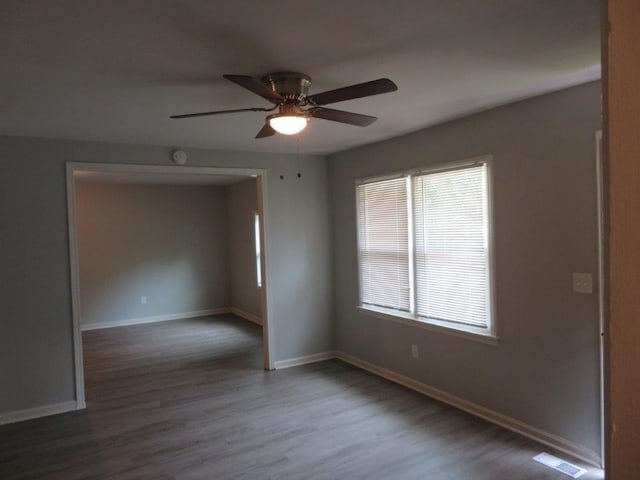 empty room with wood-type flooring and ceiling fan