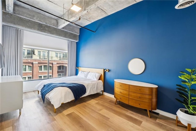 bedroom with light hardwood / wood-style flooring