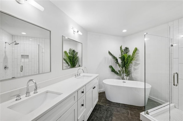 bathroom featuring tile patterned floors, vanity, and independent shower and bath