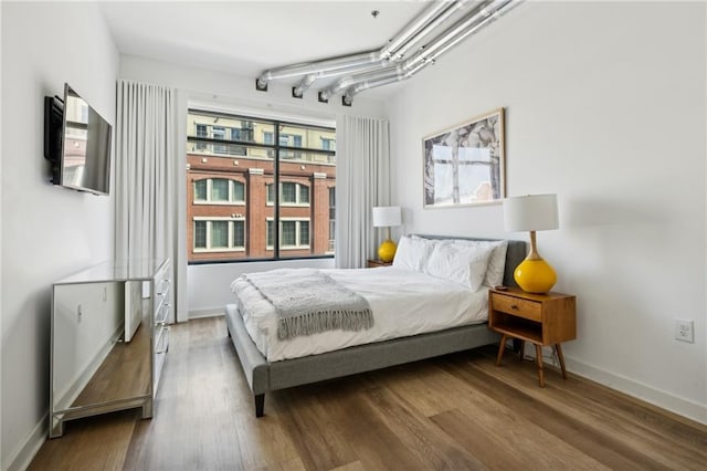 bedroom featuring hardwood / wood-style flooring