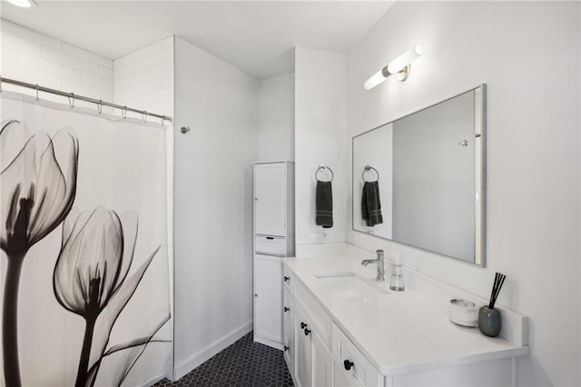 bathroom featuring vanity and curtained shower