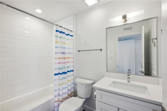 full bathroom featuring toilet, vanity, and shower / bath combo