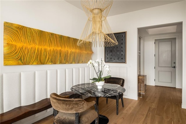 2233 Peachtree Rd NE Unit 1207, Atlanta, GA 30309 - dining area featuring wood finished floors