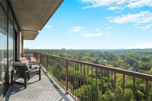 2233 Peachtree Rd NE Unit 1207, Atlanta, GA 30309 - balcony featuring a forest view
