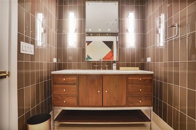 2233 Peachtree Rd NE Unit 1207, Atlanta, GA 30309 - bathroom featuring tile walls and vanity