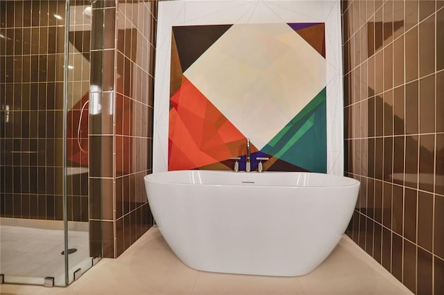 2233 Peachtree Rd NE Unit 1207, Atlanta, GA 30309 - bathroom featuring a shower stall and a freestanding bath