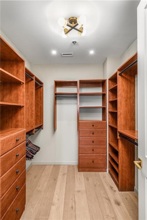 2233 Peachtree Rd NE Unit 1207, Atlanta, GA 30309 - walk in closet featuring light wood-style flooring