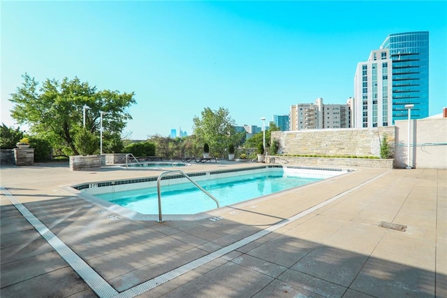 2233 Peachtree Rd NE Unit 1207, Atlanta, GA 30309 - community pool with a patio and a city view