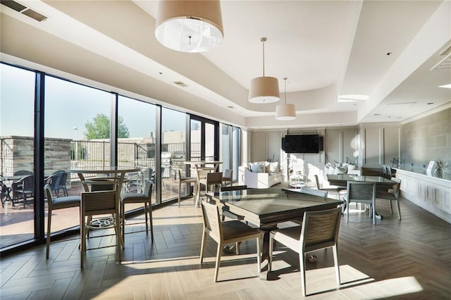 2233 Peachtree Rd NE Unit 1207, Atlanta, GA 30309 - dining space featuring a raised ceiling
