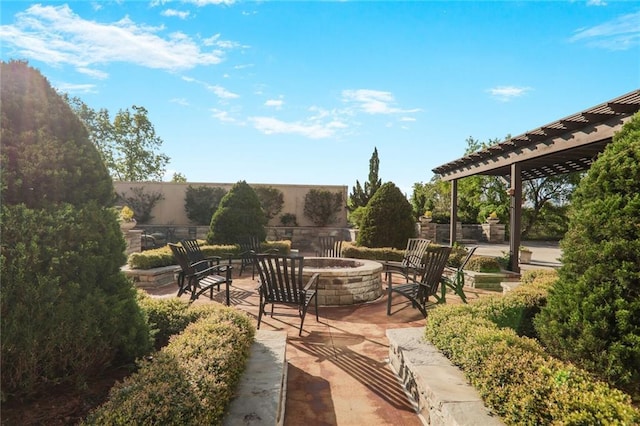 2233 Peachtree Rd NE Unit 1207, Atlanta, GA 30309 - view of patio featuring a fire pit and a pergola