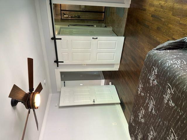 2314 Bryant Dr, Atlanta, GA 30344 - bedroom featuring wooden walls