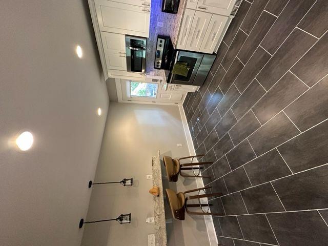 2314 Bryant Dr, Atlanta, GA 30344 - kitchen featuring white cabinets