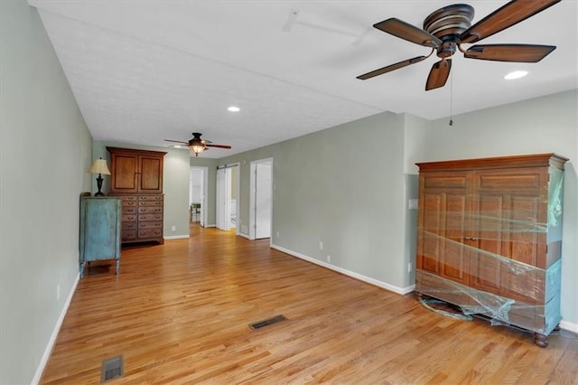 3122 Harmony Rd, Temple, GA 30179 - unfurnished living room with ceiling fan, light wood-type flooring, and recessed lighting