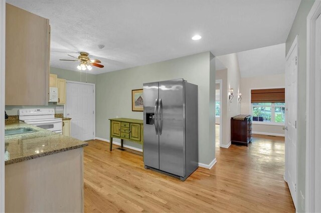 3122 Harmony Rd, Temple, GA 30179 - kitchen featuring white appliances, ceiling fan, light wood-style floors, dark stone counters, and recessed lighting